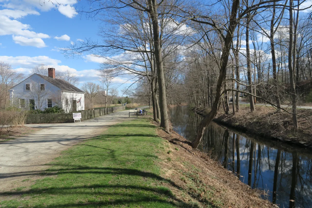 The Blackstone Canal and towpath run beside the Captain Wilbur Kelly House museum.